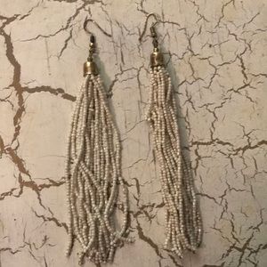White beaded dangly earrings